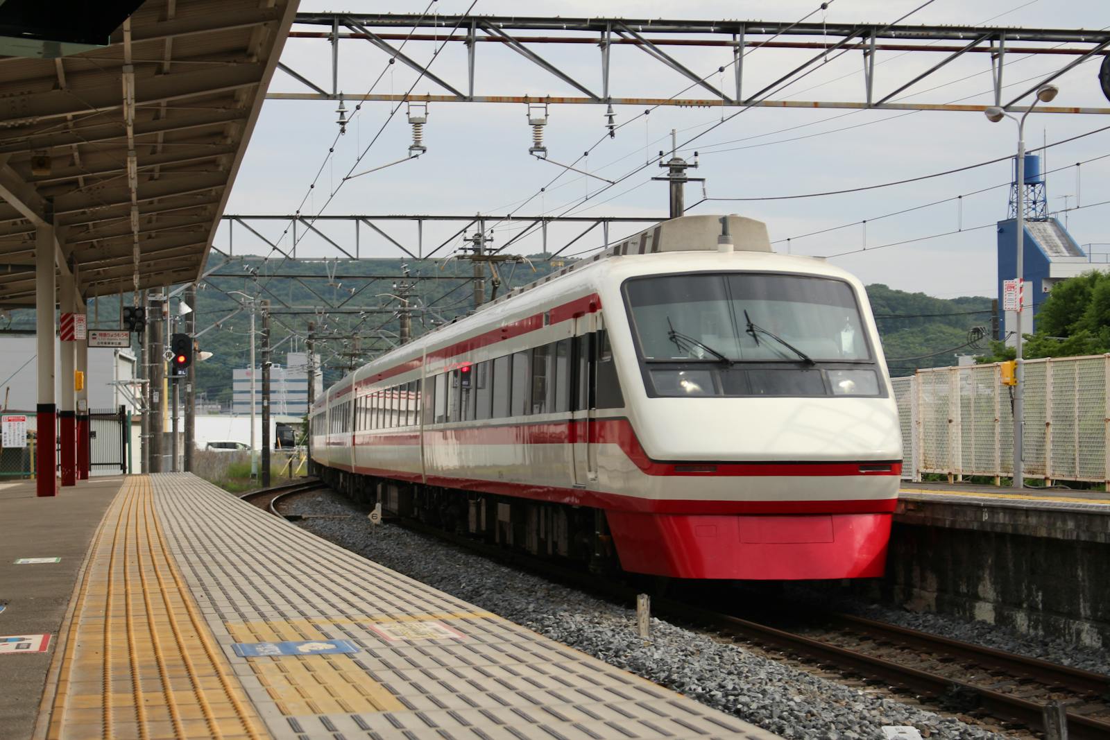 Japanese train arriving at a city station platform