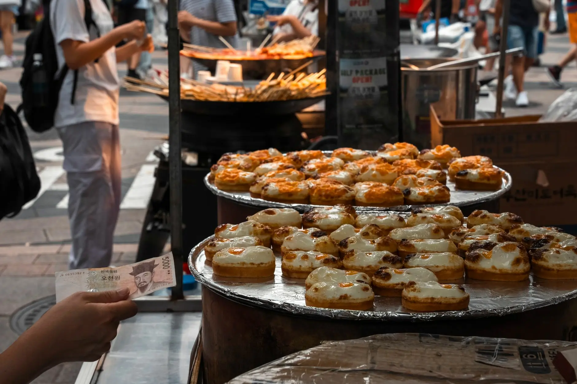 Korean hotteok sweet pancakes being cooked on a Seoul street