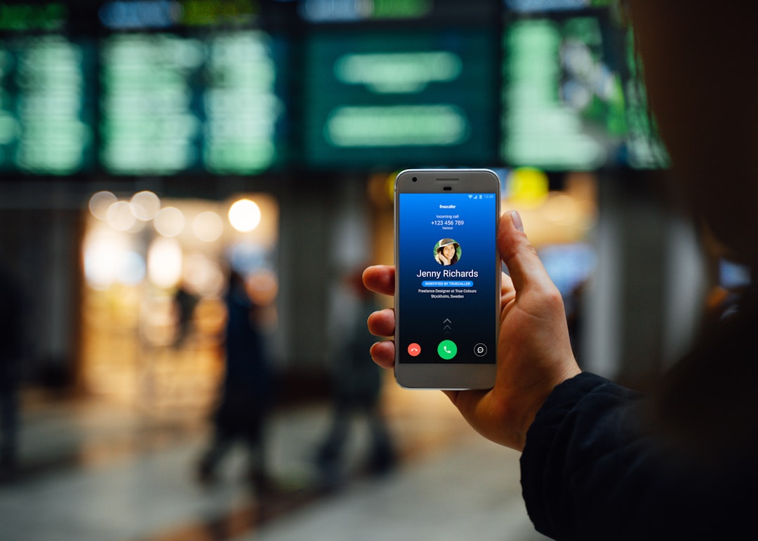 Traveller checking mobile data options at an airport