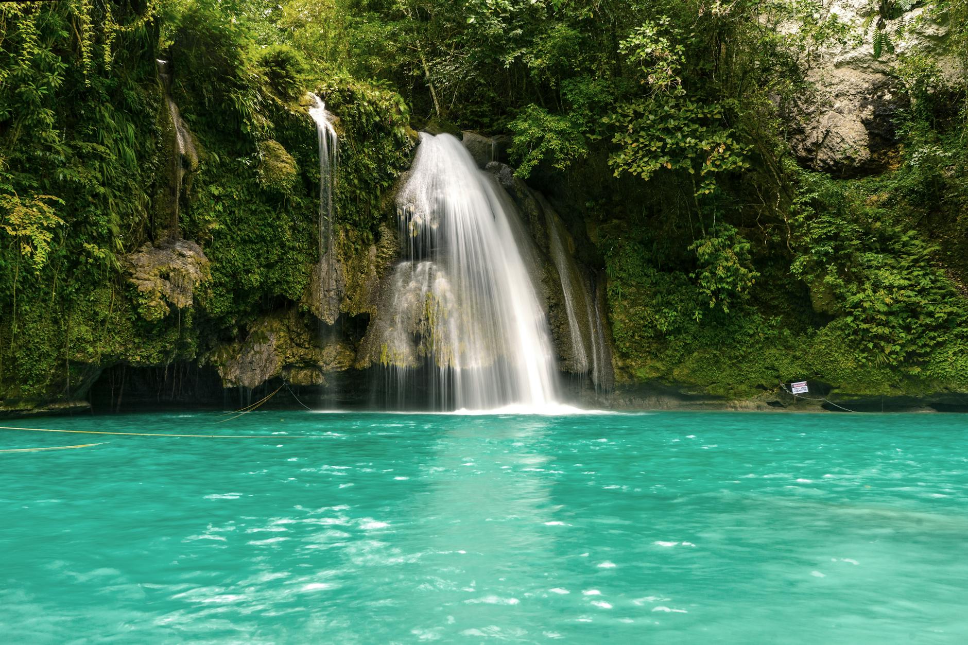 Turquoise waterfall near Cebu in the Philippines