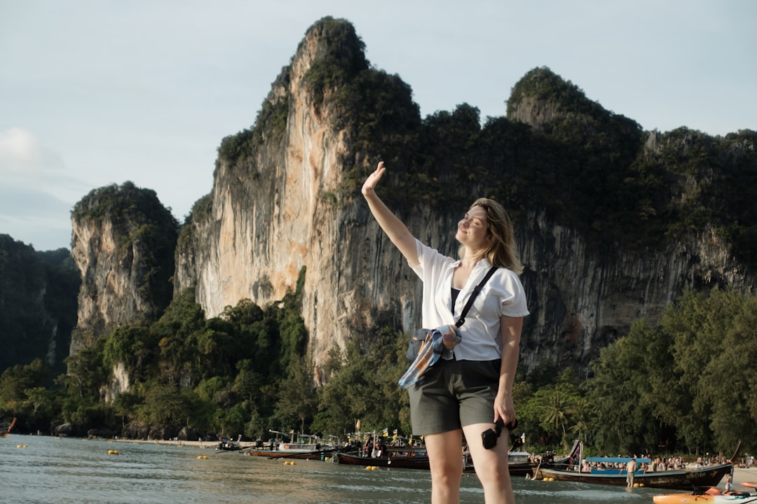 Traveller using a phone to book transport in Southeast Asia