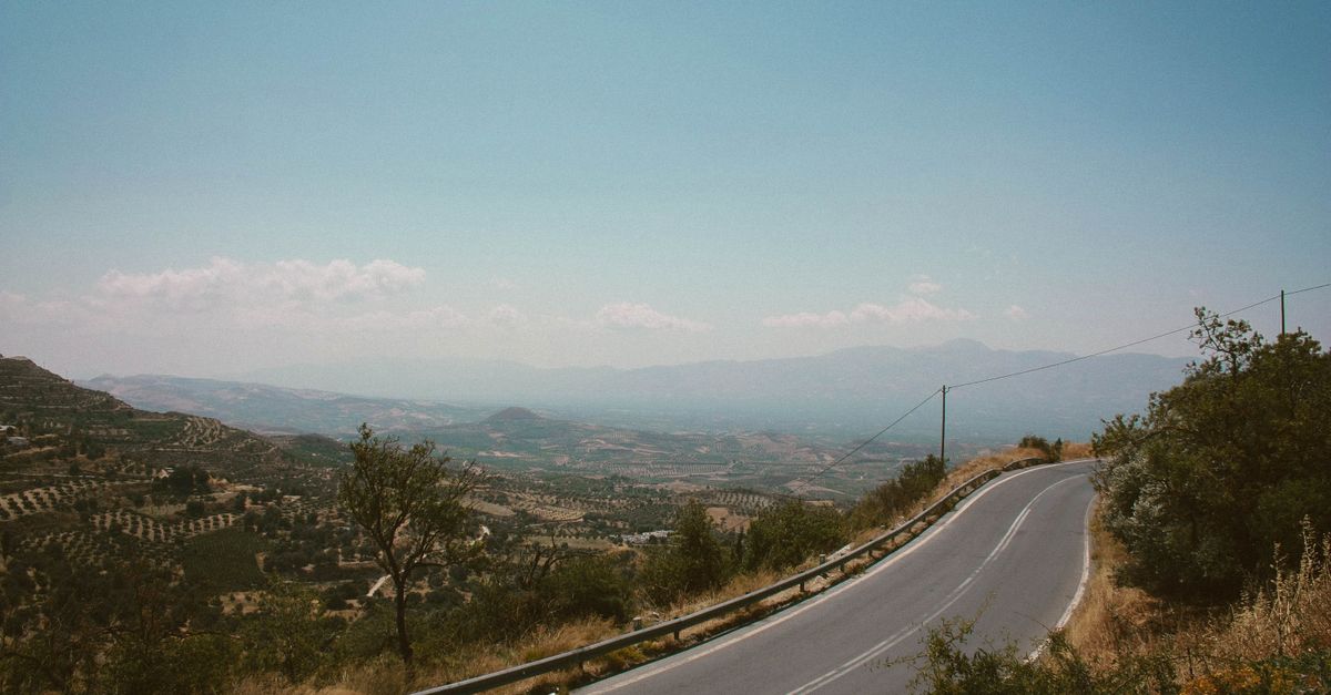 Winding paved road through the hills near Rethymno in Crete
