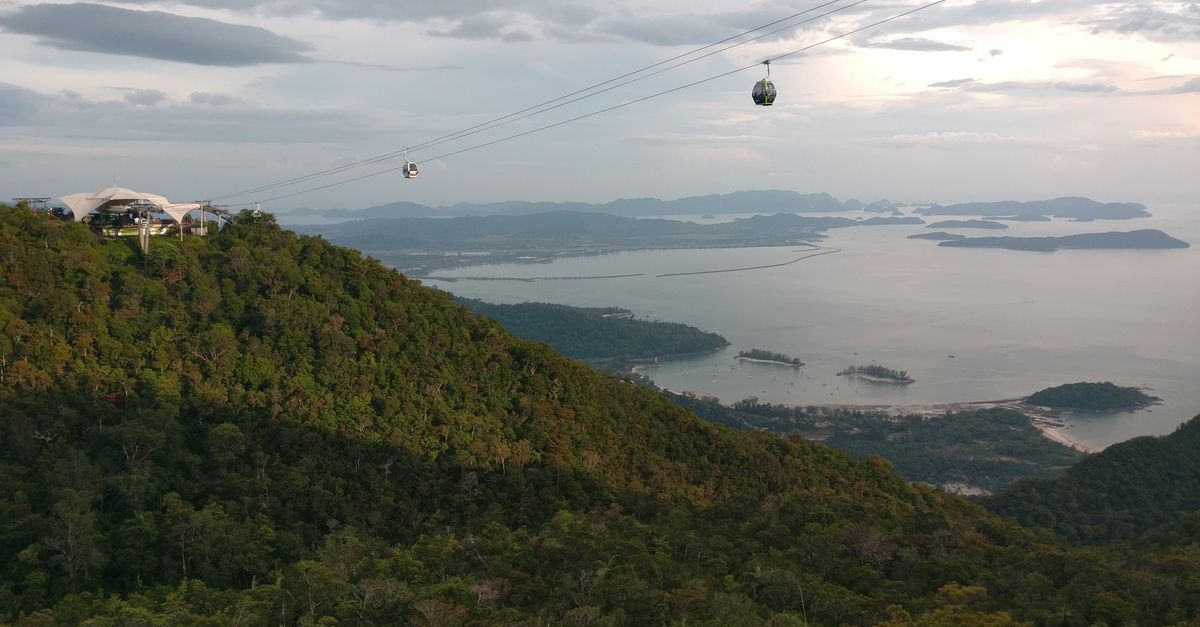 Langkawi cable cars above forested hills and the coast